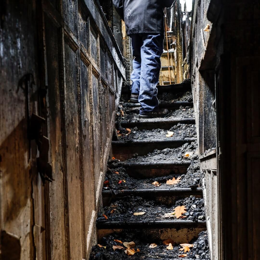 Fire-damaged stairway awaiting emergency fire damage cleanup