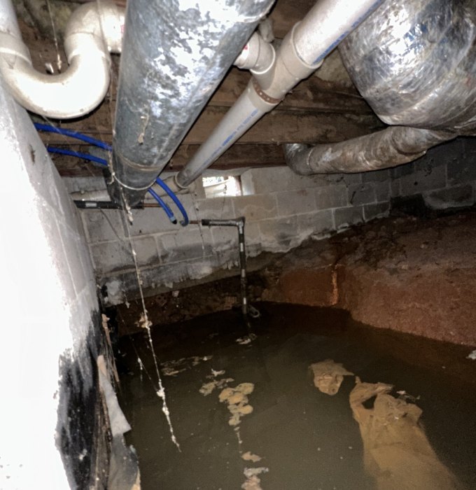 Crawl Space Drain Pipe Backup Knoxville TN Kitchen drain line and garbage disposal maintenance under a Knoxville home