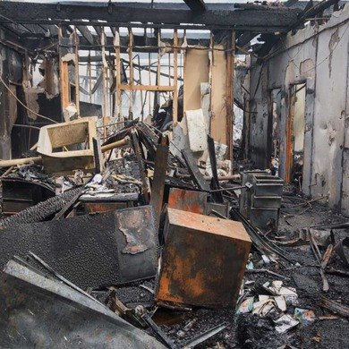 Fire Damaged Home Interior Knoxville TN Charred walls, ceiling framing and debris inside a fire-damaged home before fire damage restoration in Knoxville, TN