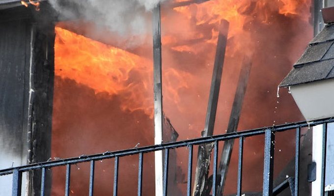House Fire Smoke and Soot Damage Knoxville Flames and thick smoke spreading through a home, causing smoke and soot damage that needs professional cleanup in Knoxville