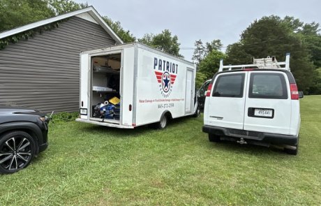 Patriot Restoration Fire Restoration Trucks Knoxville Patriot Restoration box truck and work van on site for fire and smoke damage restoration near Knoxville, TN